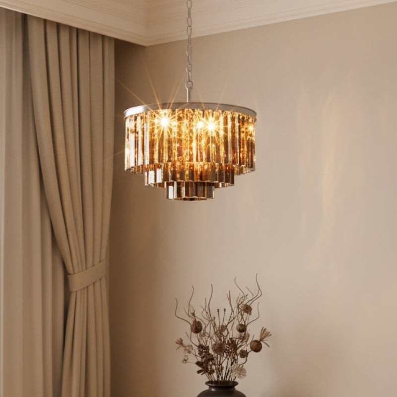 Amber crystal chandelier near curtains and decorative vase