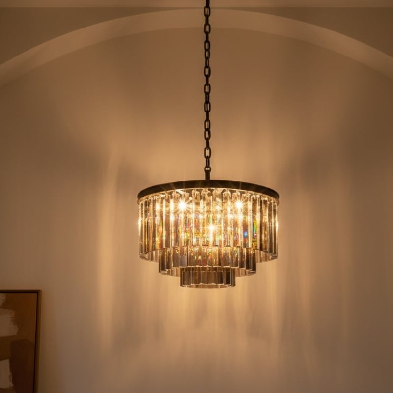 Aurevon chandelier in a dim room corner with wall light pattern